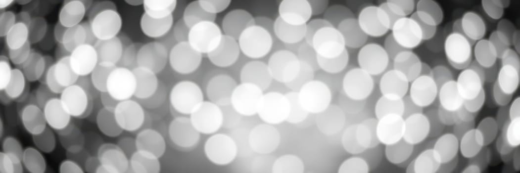 A beautiful array of bright, blurred lights fills the space, creating a magical and festive atmosphere for a celebration. The bokeh effect adds depth and warmth to the scene.