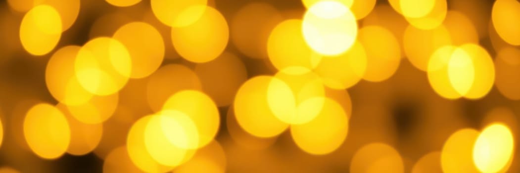 A multitude of soft golden bokeh lights fills the background, creating a warm and inviting ambiance perfect for evening gatherings or celebrations. The lights blur gently, setting a cozy mood.