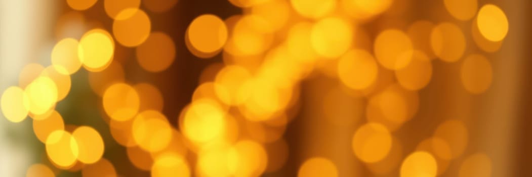 Soft, glowing bokeh lights fill the background, creating a warm, inviting ambiance suited for an evening celebration. The golden hues enhance the festive spirit.