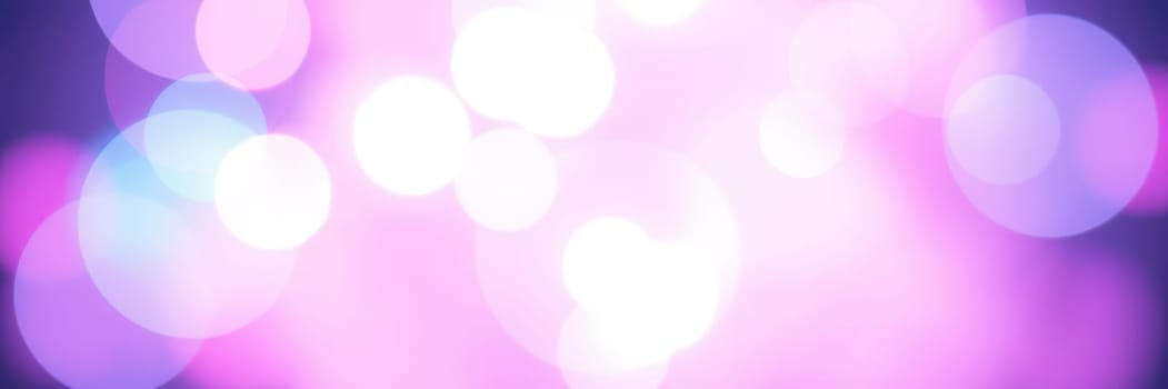 A mesmerizing display of colorful bokeh lights in shades of pink, blue, and purple creates an enchanting atmosphere during a nighttime event, enhancing the overall aesthetic.