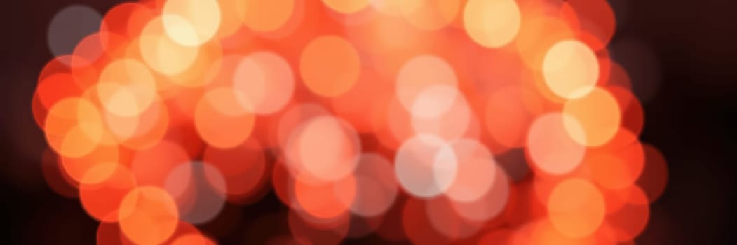 Colorful bokeh lights illuminate the background, adding a festive feel to the gathering. The warm glow enhances the celebratory ambiance, inviting connection and joy.