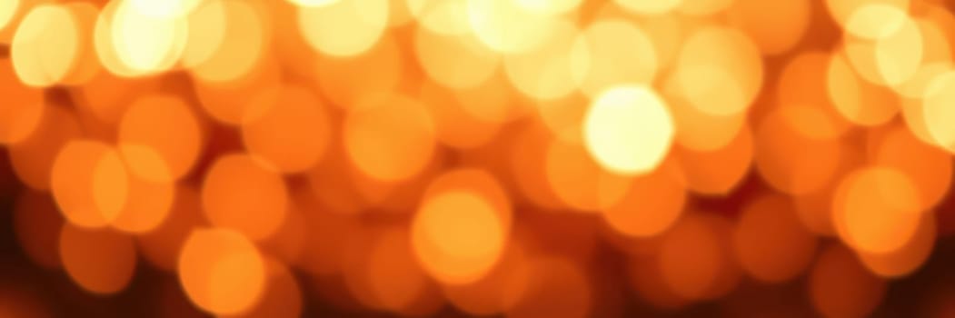 Warm golden bokeh lights create a magical atmosphere during a vibrant evening celebration filled with joy and laughter, setting the tone for memorable moments.