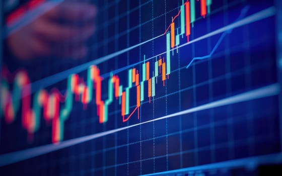 Candlestick charts on a digital trading platform represent stock market trends. Traders analyze price movements in real time, capturing market dynamics and shifts.