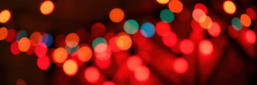 Vibrant and soft bokeh lights illuminate the background, enhancing the joyful ambiance of a gathering held during the evening hours, creating a warm and inviting setting.