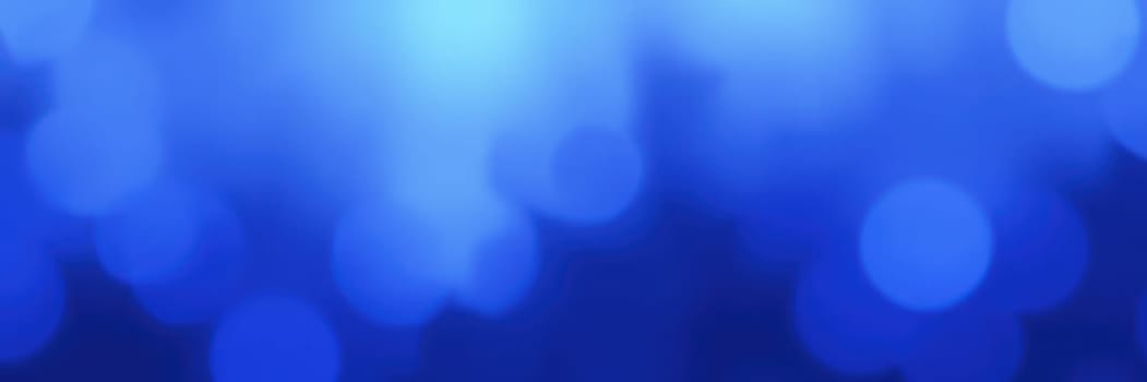 A collection of soft blue lights forms a gentle bokeh effect, creating an ethereal atmosphere ideal for backgrounds, digital designs, and artistic presentations.