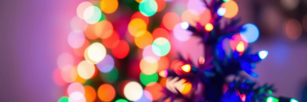 A beautifully decorated Christmas tree stands in a warmly lit room, surrounded by vibrant, colorful lights that create a cheerful holiday ambiance.