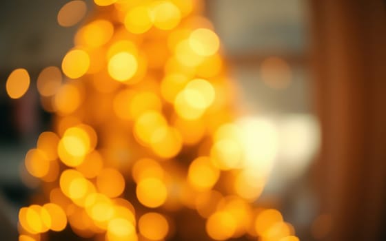 Soft, warm golden lights illuminate a Christmas tree, creating a cozy and inviting atmosphere in a home during the holiday season. The background is softly blurred.