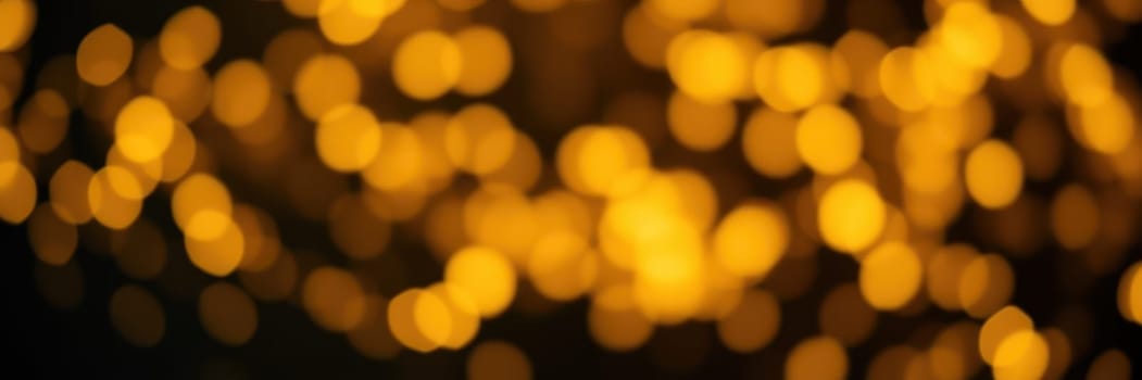 Golden bokeh lights shimmer softly against a dark background, creating a warm and festive ambiance. This enchanting display adds a magical touch to evening celebrations and gatherings.