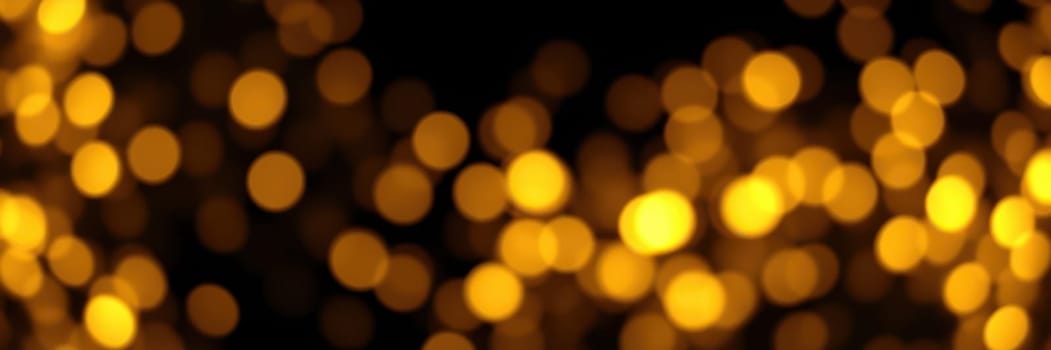 Soft, glowing golden lights shimmer in a blurred background, creating a magical ambiance perfect for festivities and special gatherings during the nighttime.