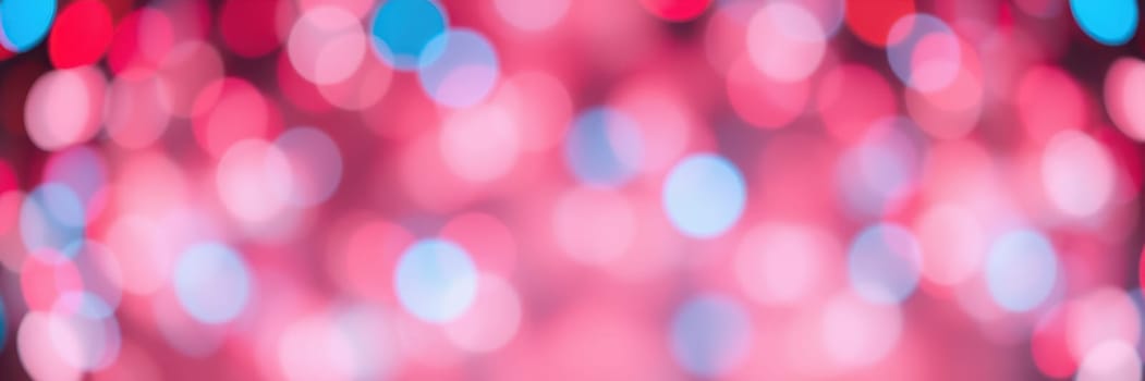 Brightly colored bokeh lights in red and blue form a captivating background, enhancing the festive mood of a nighttime celebration or event. The blurred effect adds a touch of magic.