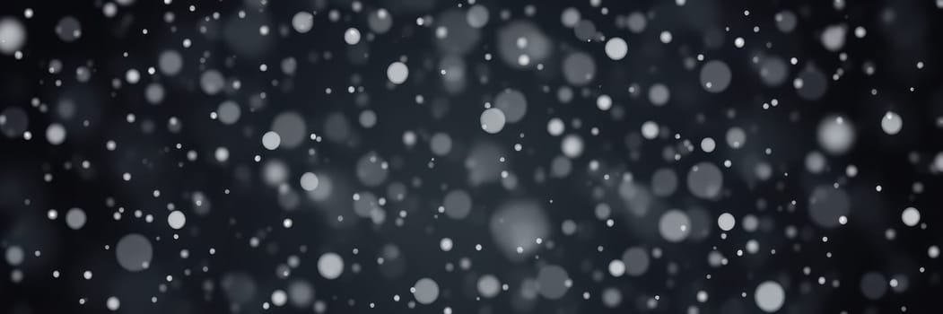 Soft snowflakes fall gently against a dark background, creating a peaceful winter ambiance as the scene captures the essence of a chilly evening.