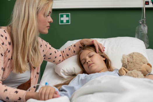 A devoted mother cares for her sick child in the hospital, showing unconditional love and unwavering support