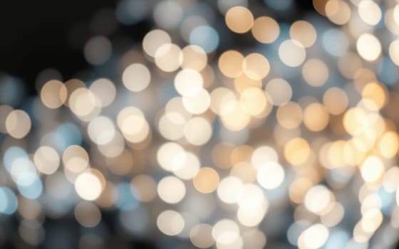 A magical atmosphere is formed by soft golden and white lights that blur into a bokeh effect, enhancing the elegance of an evening gathering or celebration.
