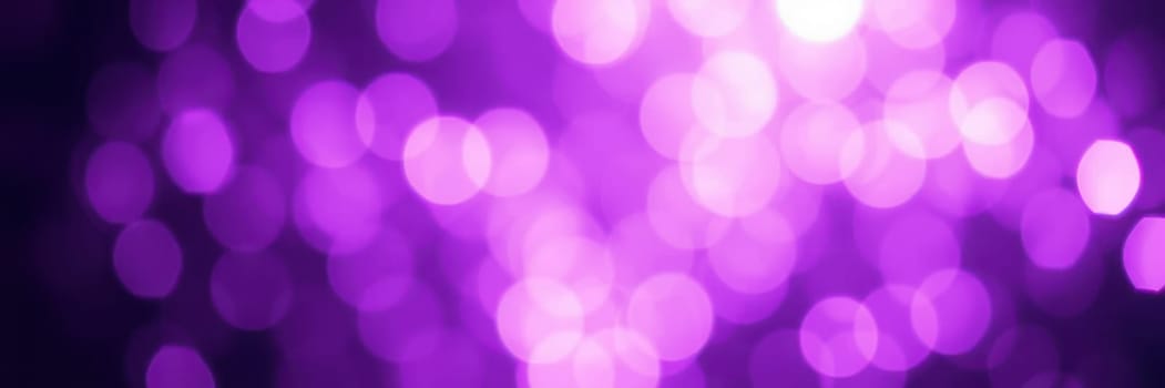 Soft, shimmering purple bokeh lights fill the background, creating an enchanting mood perfect for an evening celebration or gathering. The gentle glow enhances the festive ambiance.