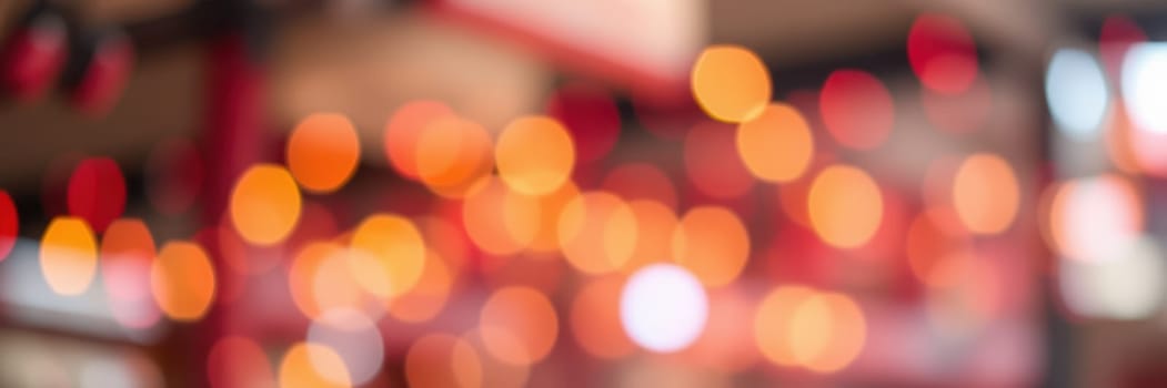 A vibrant setting filled with warm, colorful bokeh lights creates a festive atmosphere during an evening celebration at a lively venue, inviting joyful interactions.