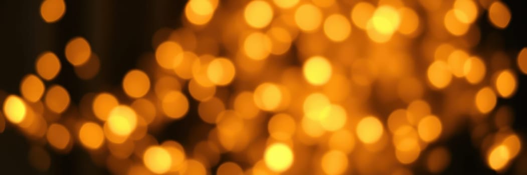 Soft golden bokeh lights fill the background, creating a warm and inviting ambiance, perfect for evening gatherings and festive celebrations among friends and family.