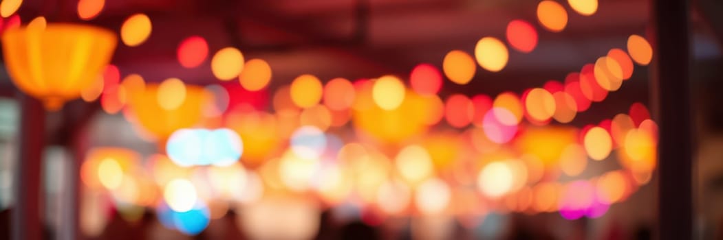 Soft, warm lights illuminate a lively atmosphere filled with excitement and joy as people gather to celebrate a special occasion at night.