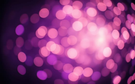 Soft, blurred circles of pink and purple light blend together, creating a warm and inviting ambiance perfect for evening events and celebrations. This atmospheric display enhances the mood.