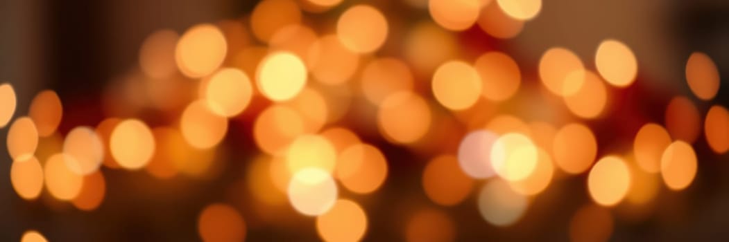 Flickering golden lights create a warm ambiance, enhancing the atmosphere of a cozy place during the evening, perfect for gatherings or celebrations.