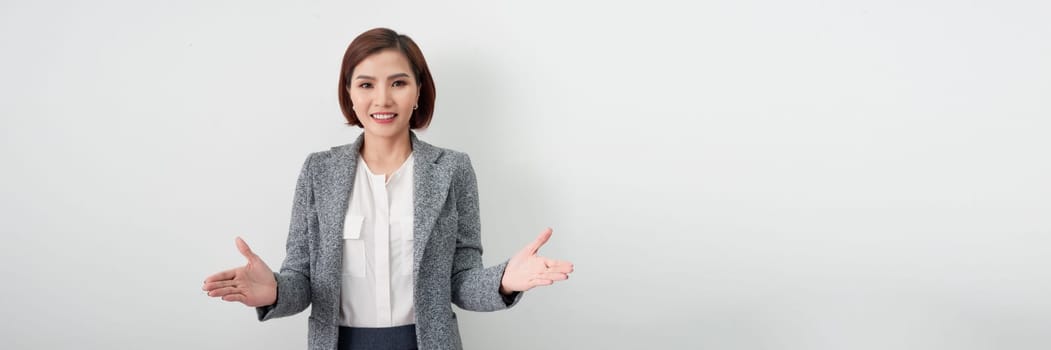 Banner of smiling happy beautiful young Asian businesswoman in casual attire doing open hand gestures