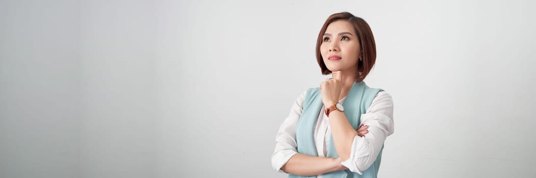 Young asian woman, professional entrepreneur standing in office clothing, smiling.