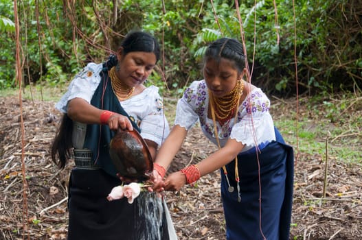 Homestyle Cleanup: Indigenous Mother 'n' Daughter Team Tacklin' Them Pots, Daughter Keepin' Hold of Them Blessed Blooms for a Good Ol' Thanksgivin' Rite. High quality photo
