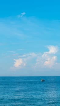 Sea sky cumulus cloud landscape view background. Calm water alone fishing boat. Destination aim progress concept.
