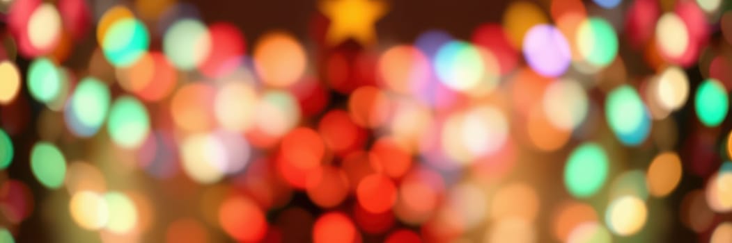 A vibrant display of multicolored holiday lights shines softly, illuminating a cozy space during the winter season, evoking a warm festive mood perfect for celebrations.