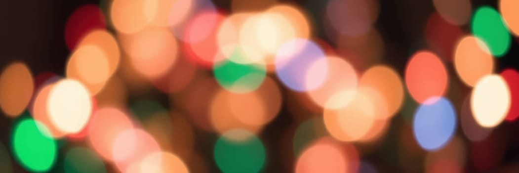 Bright and vibrant bokeh lights fill the scene, illuminating the surrounding area with a warm and joyful ambiance during evening festivities in a bustling city.