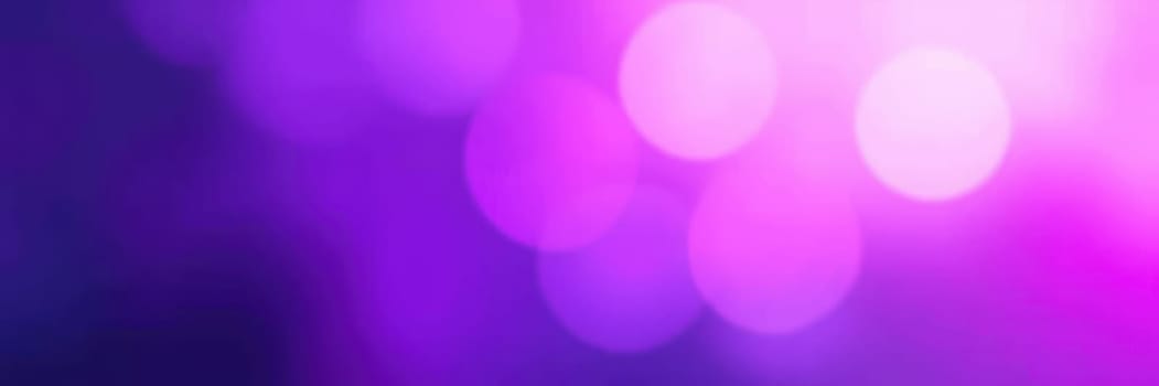 Glowing purple lights softly illuminate the area, creating a magical ambiance for guests enjoying an evening event at a local venue, enhancing the festive atmosphere.