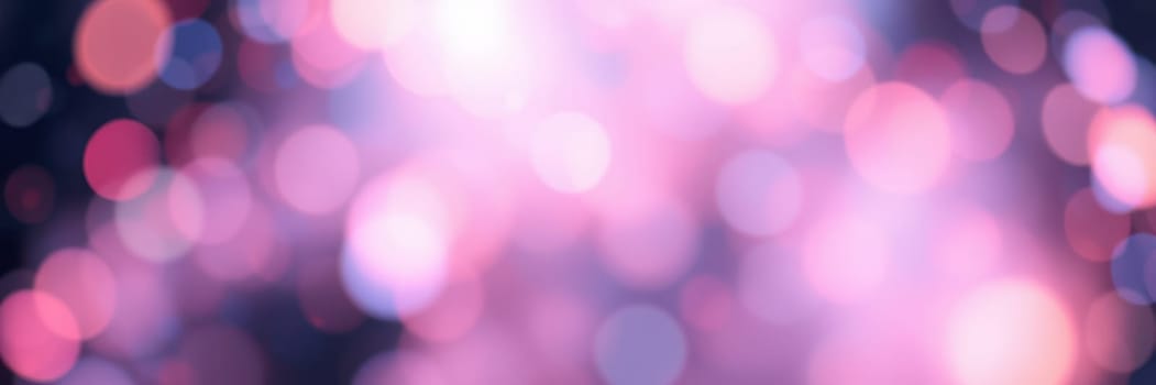 Bright bokeh lights in various colors illuminate the night sky, creating a joyful and vibrant atmosphere during a celebration at an outdoor event.