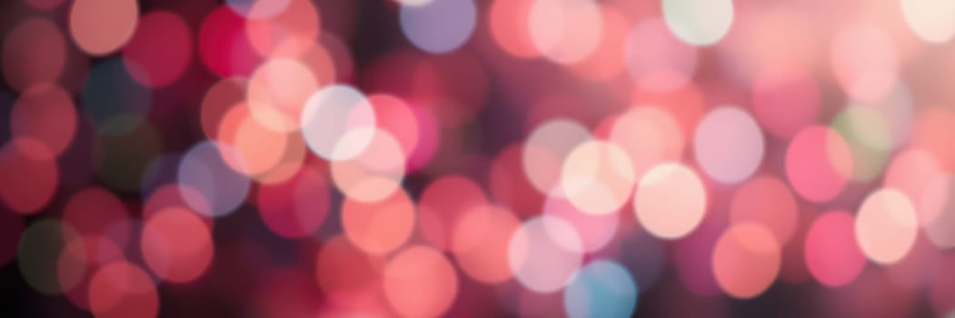 Vibrant and softly blurred bokeh lights in warm hues create an enchanting ambiance ideal for festive occasions and joyful gatherings, evoking a sense of celebration.