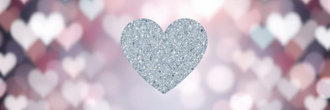 A shimmering silver heart glitters prominently against a soft bokeh background filled with pastel colors. This festive setting radiates warmth and joy, perfect for expressing love.