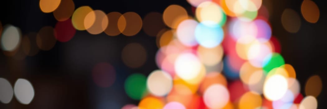 Vibrant lights create a lively atmosphere during a celebration at night, enhancing the festive spirit with colorful hues and cheerful energy throughout the scene.