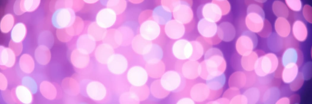 Soft, colorful bokeh lights fill the background, creating a magical ambiance for a lively event in an indoor environment. Guests enjoy the festive atmosphere and celebrate together.