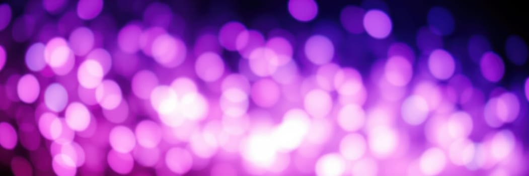 Colorful dots of purple and pink light sparkle against a dark backdrop, creating a dreamy atmosphere perfect for nighttime festivities and celebrations.