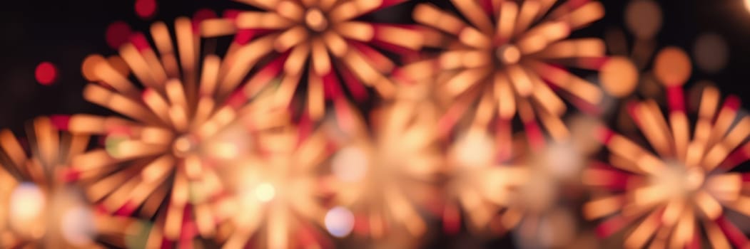 Bright fireworks burst into vibrant colors, creating a dazzling display against the night sky during a festive celebration in a lively city.