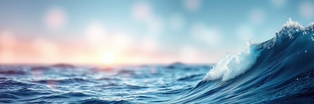 Waves wash ashore at dusk, creating a peaceful atmosphere. The sun sets on the horizon, casting warm hues across the ocean, reflecting on the water's surface.