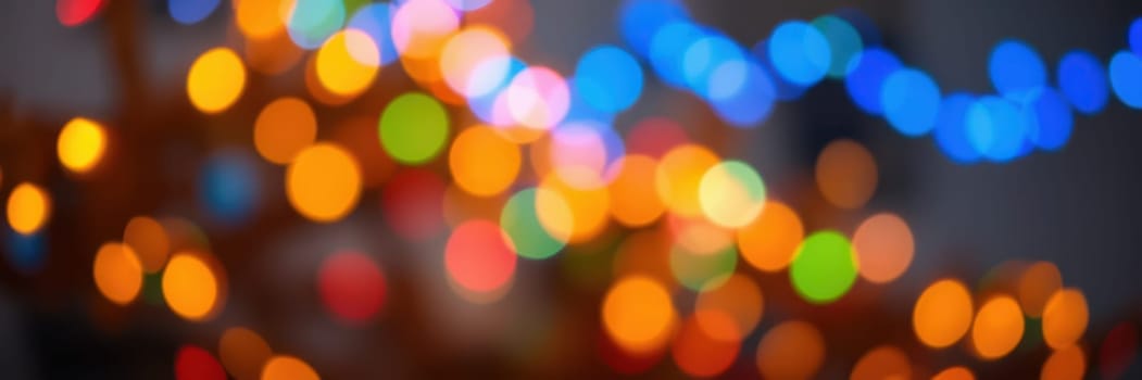 Warm, colorful lights enhance the festive atmosphere of a cozy gathering, creating a cheerful ambiance filled with joy and excitement among friends or family.