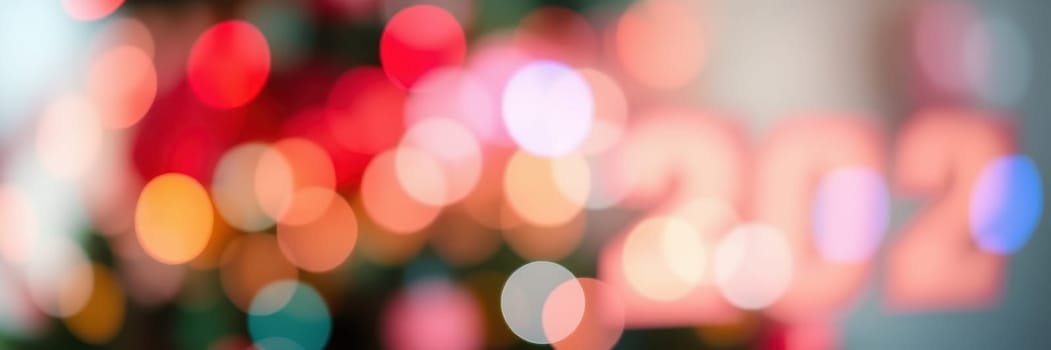 Bright and colorful bokeh lights create a joyful atmosphere for New Year celebrations, highlighting the transition to 2022 in a festive indoor setting.