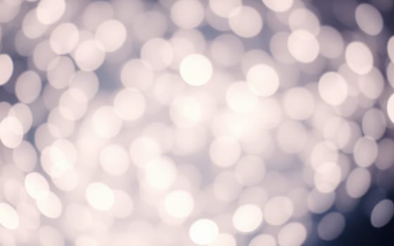 Delicate circles of light fill the background, creating a magical ambiance in a softly blurred setting, perfect for evening gatherings or celebrations.