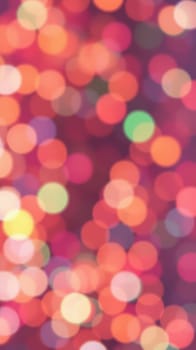 Vibrant bokeh lights in various colors blend together, creating a joyful ambiance perfect for an evening celebration or gathering at a festive event.