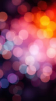 Soft, vibrant bokeh lights illuminate the surroundings with hues of pink, blue, and orange, creating a whimsical atmosphere during an evening event in the city.