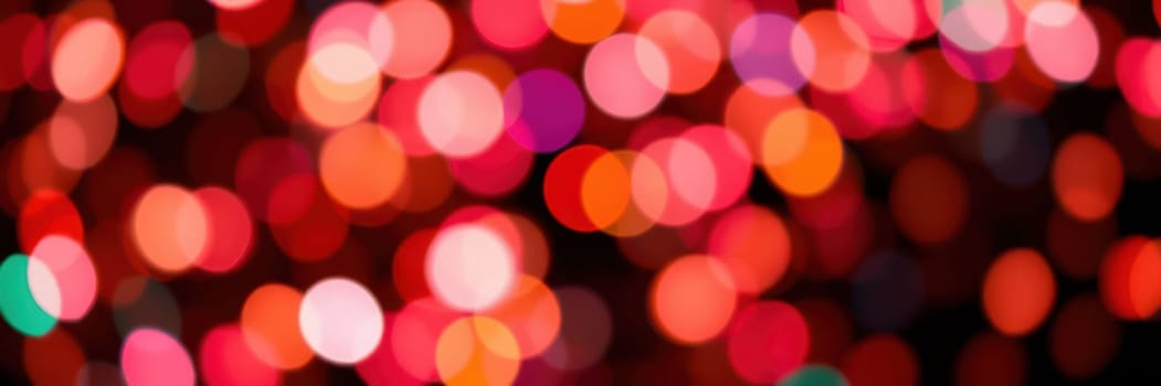 Bright and vibrant bokeh lights blur beautifully, filling the cozy atmosphere with warmth and excitement during a festive evening gathering with loved ones.
