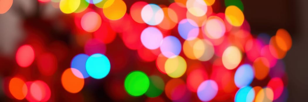 Brightly colored lights create a vibrant atmosphere, filling the indoor space with warmth and joy. The arrangement hints at a festive gathering or celebration.