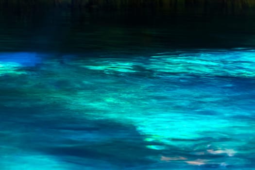 Beautiful Cenote Park Minotauro with limestone rocks turquoise blue green water and nature jungle around it in Xpu Ha Quintana Roo Mexico.