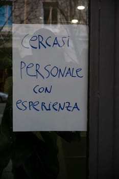 Cremona, Italy - November 27th 2024 Sign seeking experienced personnel displayed on a shop window in cremona, italy, reflecting current job market trends