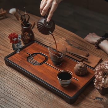 A serene tea ceremony setting beautifully showcasing the intricate art of tea pouring and elegant presentation