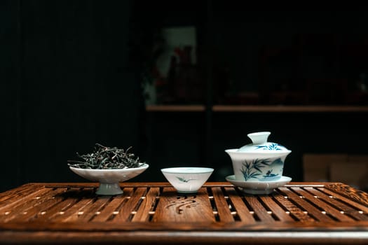 A serene tea setup with fine teaware and aromatic loose leaf tea, ideal for relaxation and tranquility