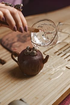 A captivating and enchanting tea ceremony that showcases a unique teapot with precise water pouring action